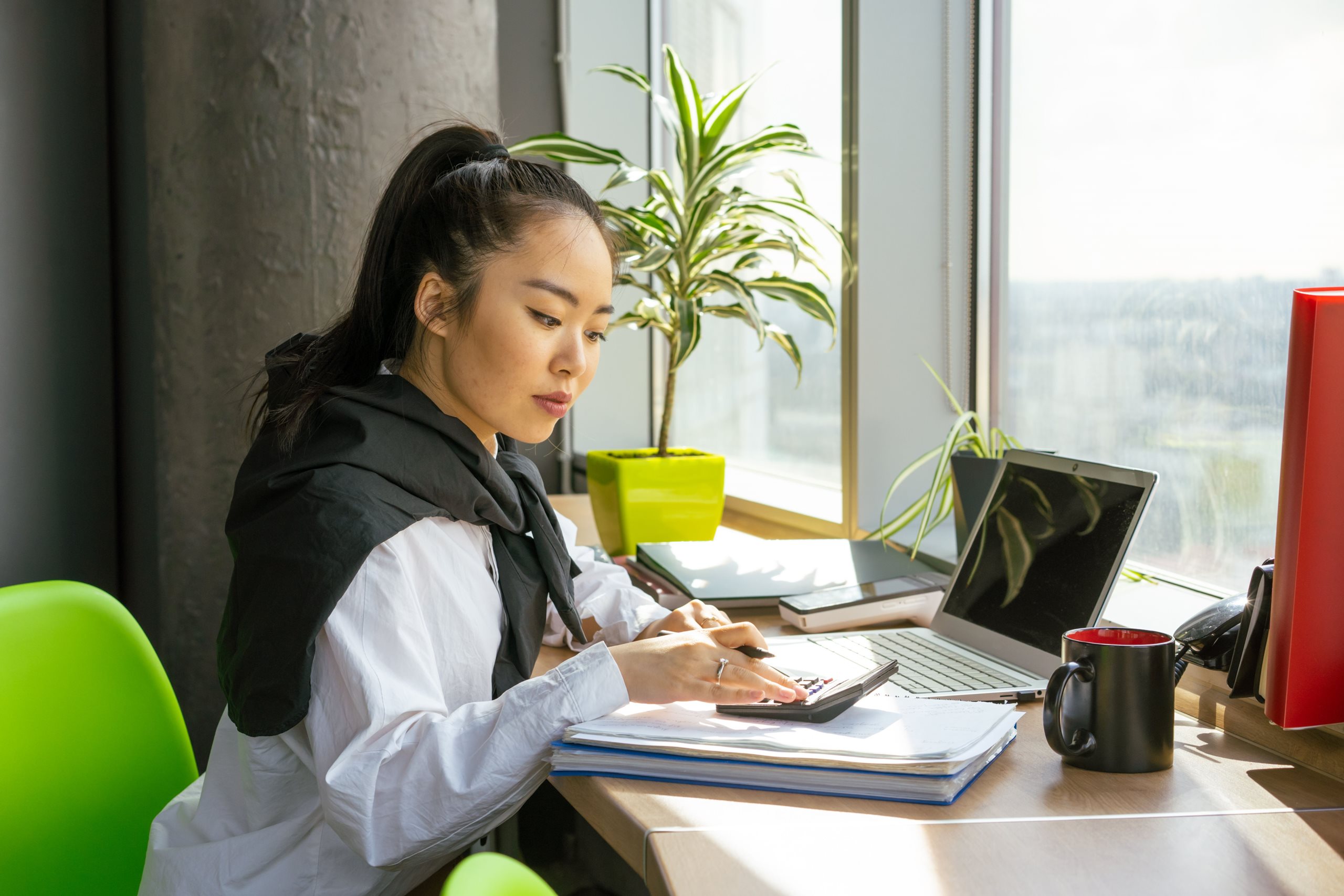 Professional reviewing documents at a desk